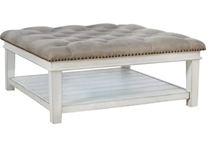 64606-signature-design-by-ashley-kanwyn-french-country-upholstered-square-ottoman-coffee-table-whitewash-whitewash-1.webp